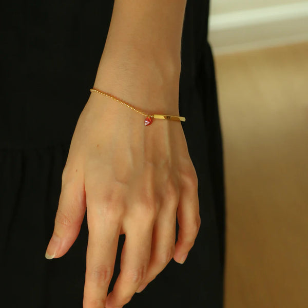 Lovelink – 18K Gold Bracelet with Red Heart Charm